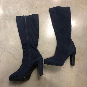 Navy blue tall boots with a heel and textured floral shaft